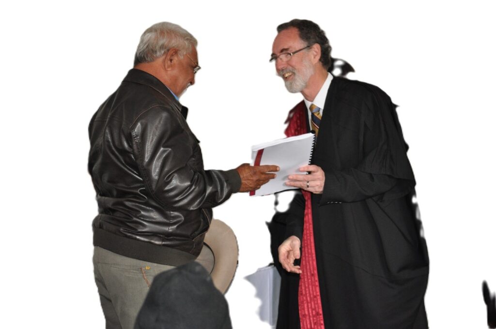 Justice John Mansfield hands over the determination documents to Bill Lennon 2011.